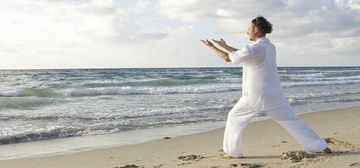 man on beach qigong meditation