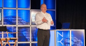 dr. vaughn r cook presenting on stage