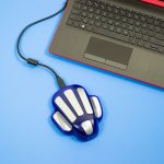 zyto hand cradle and laptop on blue background