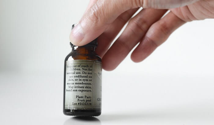 hand showing essential oil label
