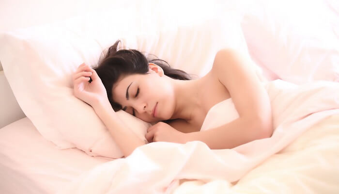 young woman asleep in bed