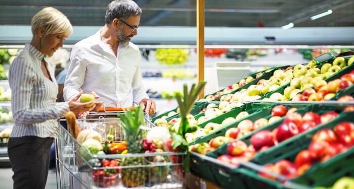 older couple shopping for produce
