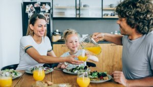 parents and child eating health meal