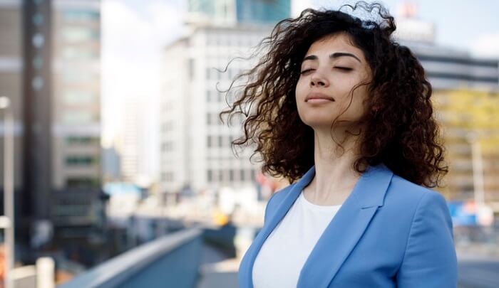 calm businesswoman - essential oils for meditation concept