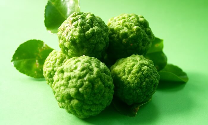 bergamot fruit on green background