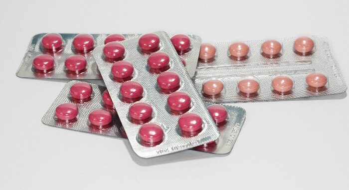 packaged iron supplements for vegans on white background