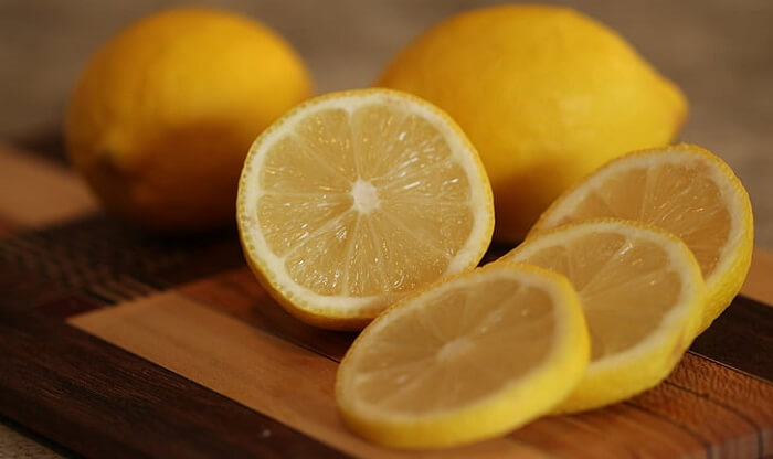 sliced lemons on cutting board