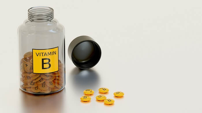 vitamin b supplement bottle and pills