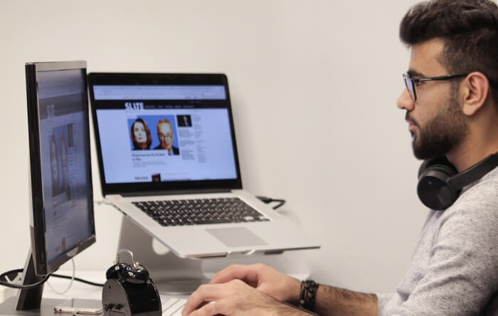man looking at computer screen