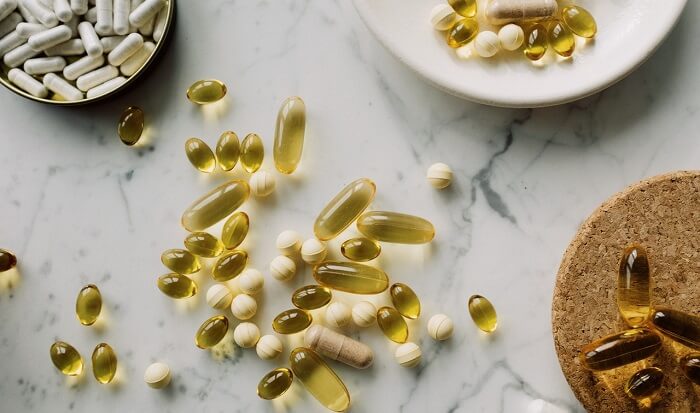 various supplement pills on marble table