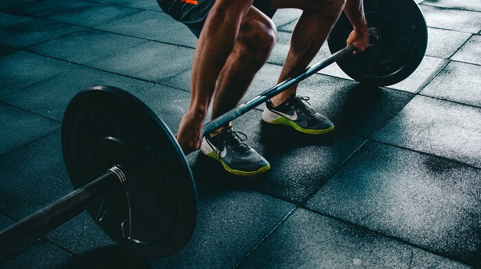 man power lifting barbel