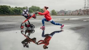 woman with stroller doing lunges
