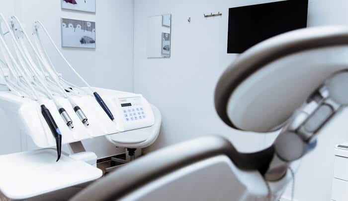 dentist tools next to dental chair