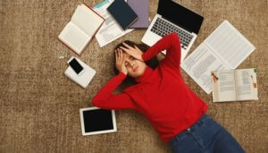 stressed-out woman lying on the floor