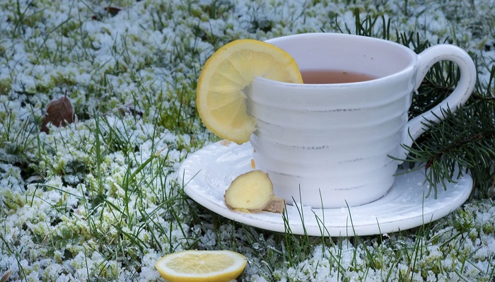 cup of ginger tea on frozen grass