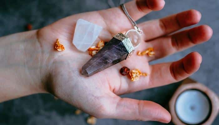 crystal pendant in hand