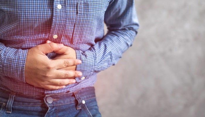 man with stomach pain - supplements for gastritis concept