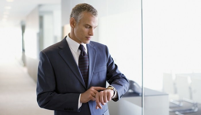 businessman checking his watch