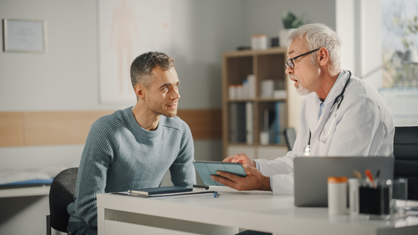 experienced doctor talking sharing test results with patient