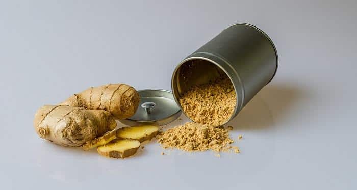 ginger root next to ginger powder in can