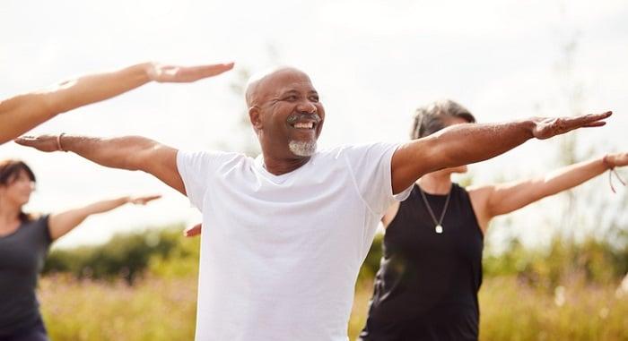 group doing yoga outdoors