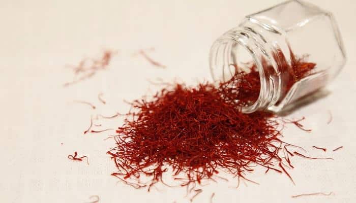 saffron emptied from jar onto table