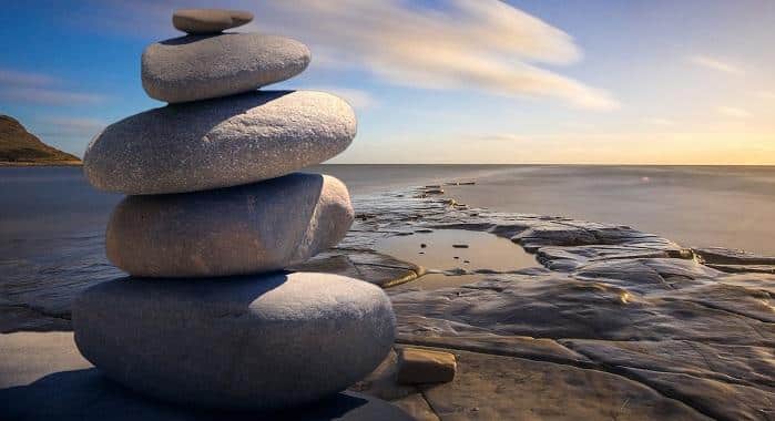 stacked rocks on seashore