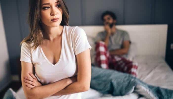 unhappy couple in bedroom
