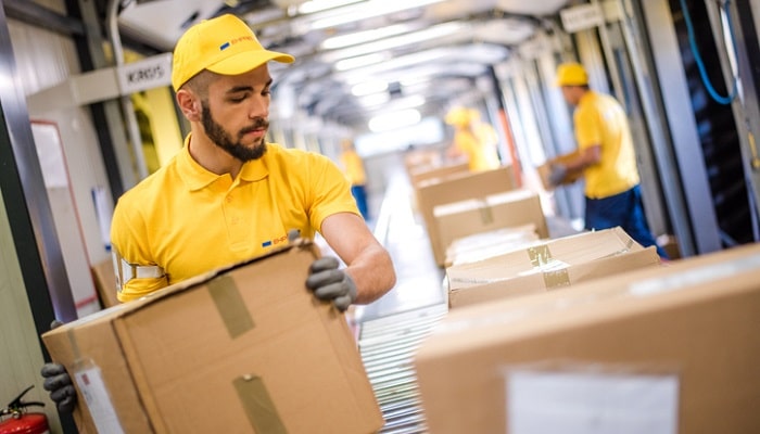 warehouse worker lifting box