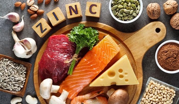 foods high in zinc - salmon next to cheese and nuts