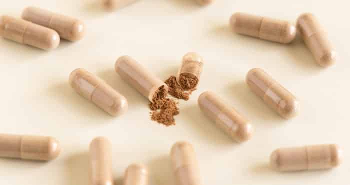 herbal supplement pills on white background