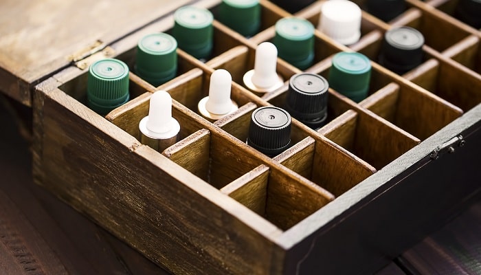 essential oil bottles in wooden box