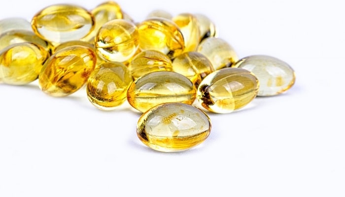 vitamin d pills on white background