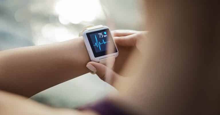 woman looking at resting heart rate on smartwatch