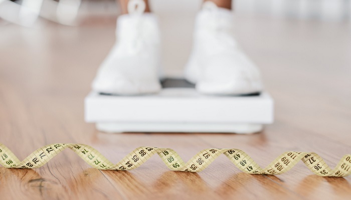 weight scale next to measuring tape