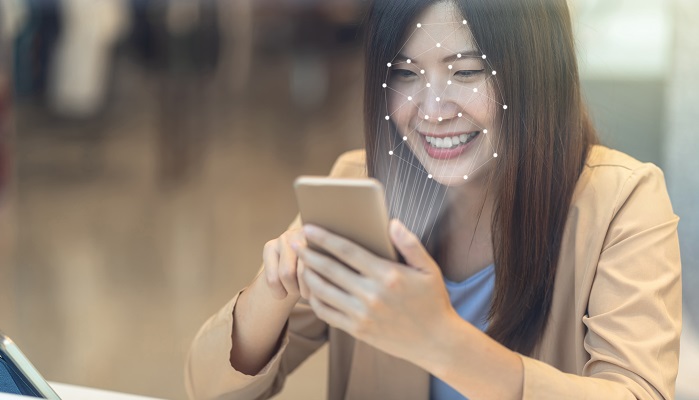 woman using face recognition app