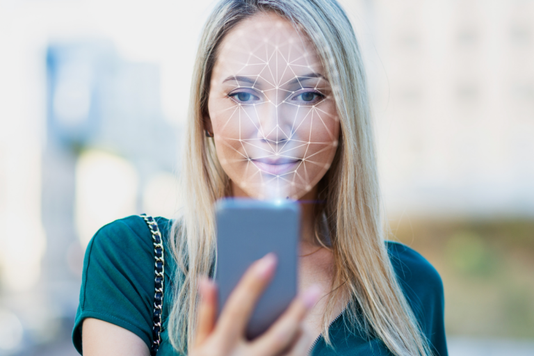 young woman scanning face with phone