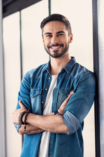 young man wearing blue button-up shirt