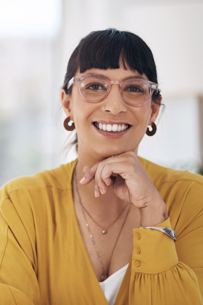 smiling woman wearing yellow blouse