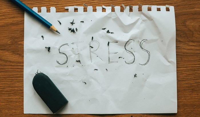 stress relief concept - erasing stress on paper