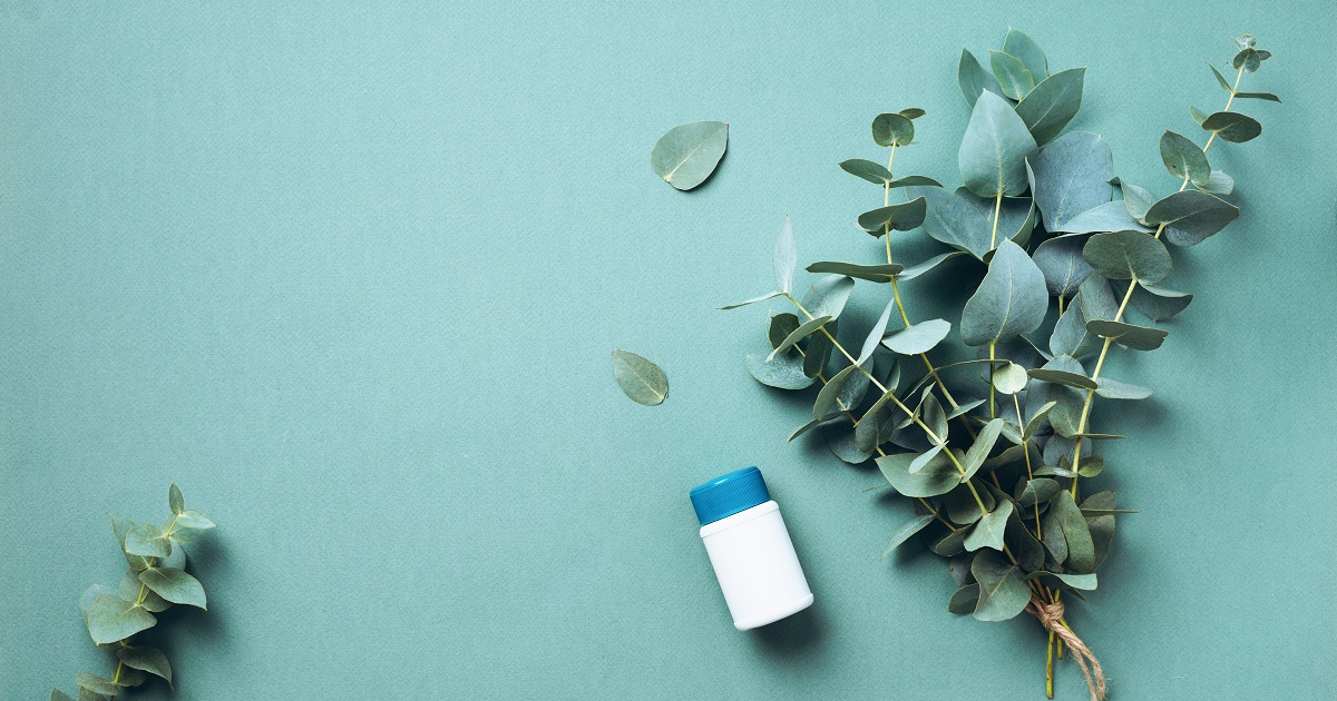 eucalyptus leaves next to bottle - supplements for sinus infections
