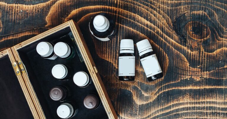 essential oils in wooden box on wood table
