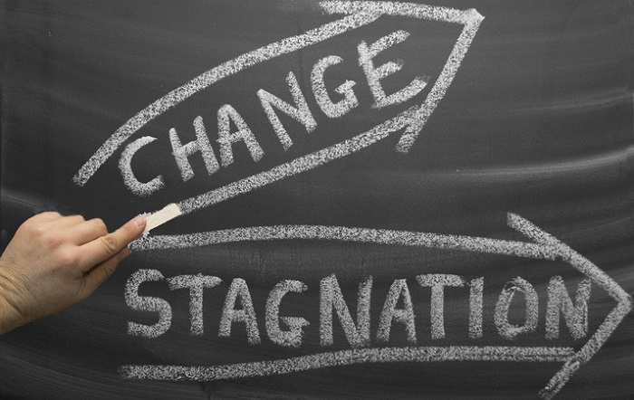 change vs. stagnation concept on chalkboard