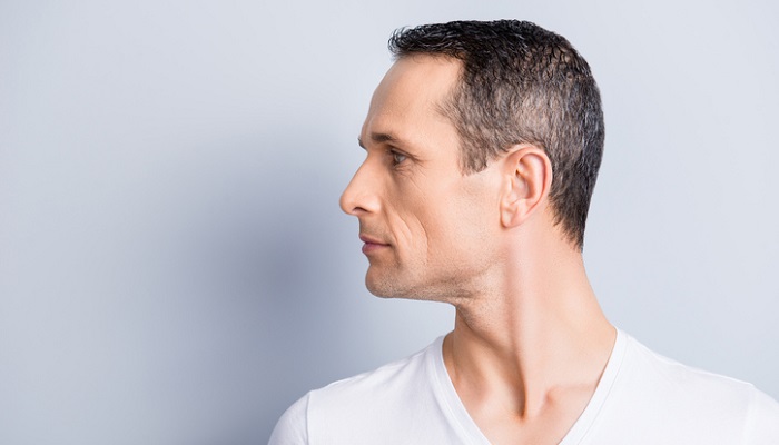 man doing neck rotation exercises for whiplash