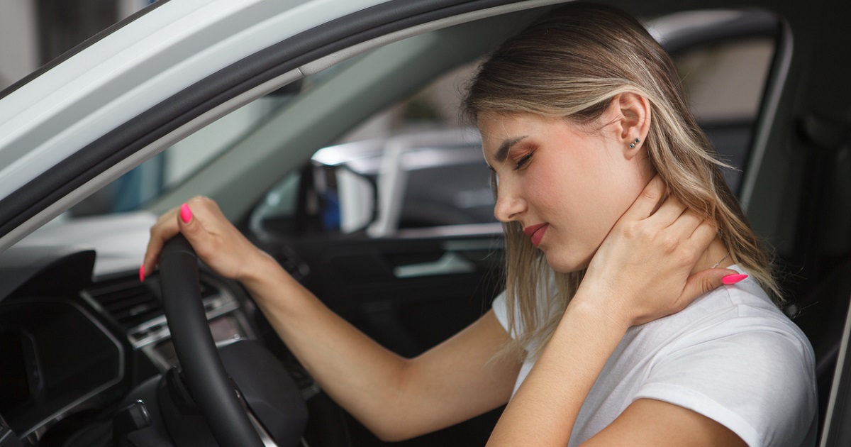 woman experiencing neck pain from whiplash