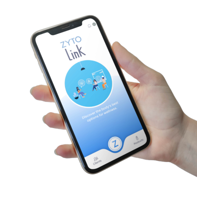 holding phone showing zyto link wellness app